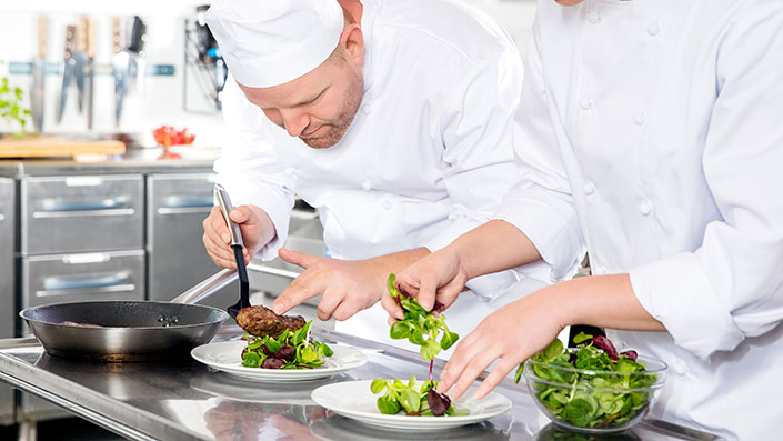 food worker plating food