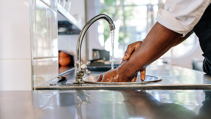 hands washing under tap