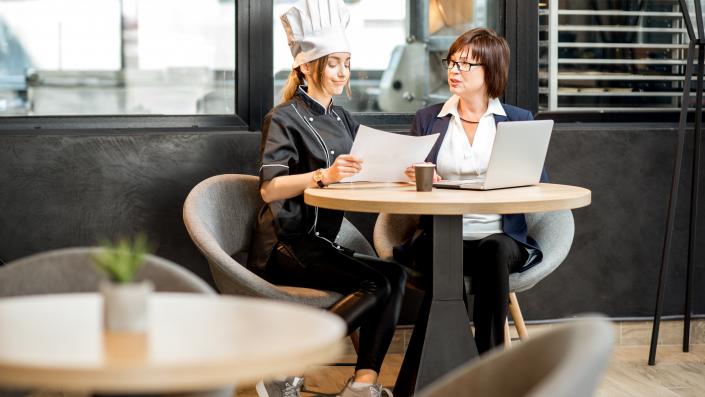 restaurant manager and chef reviewing a Food Safety Program
